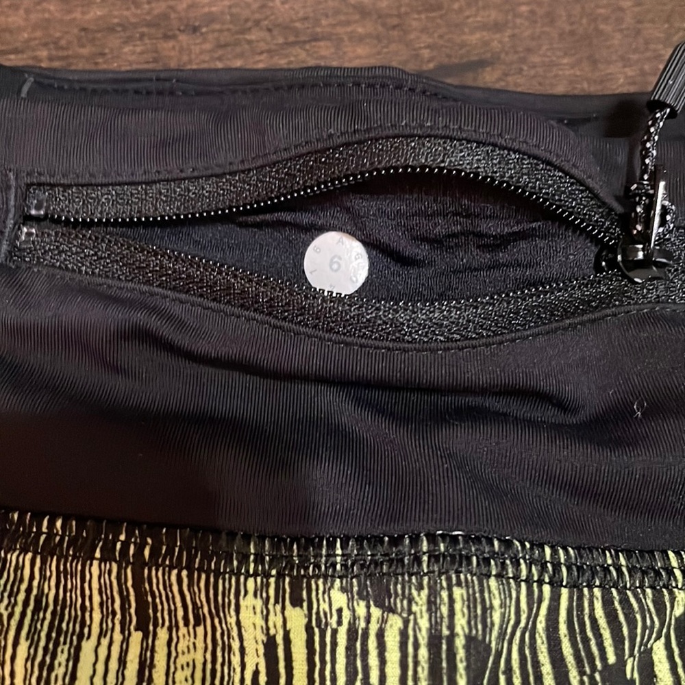 Black and yellow Lululemon Speed Shorts - Picture 4 of 4